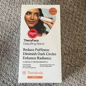 Therabody TheraFace Depuffing Wand - White and Orange